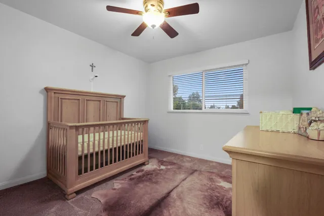 a bathroom with a toilet sink and vanity