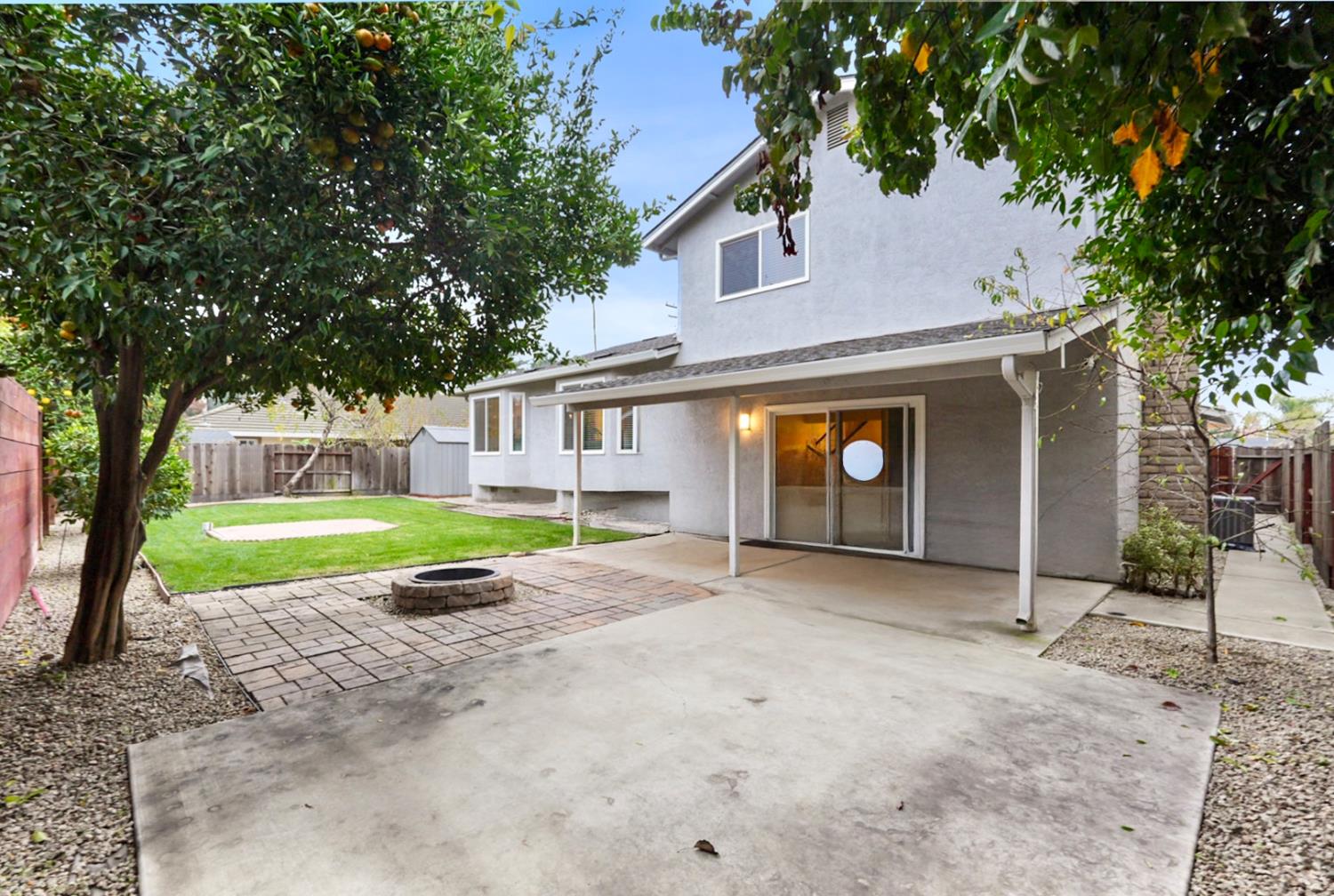 1820 North Berkeley Avenue Turlock, CA 95382 - Photo 25 of 29 a view of a house with a yard and large tree