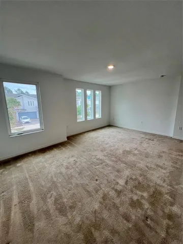 a view of a livingroom with a kitchen