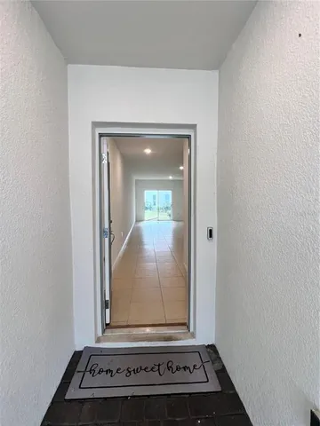 a view of kitchen with furniture and cabinets