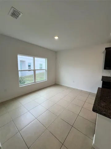 a kitchen with stainless steel appliances a sink a stove a microwave and a refrigerator