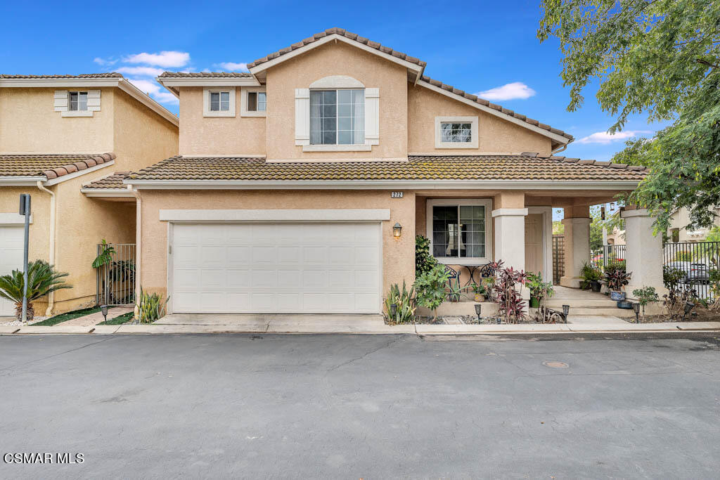 272 Springmist Lane Simi Valley, CA 93065 - Photo 1 of 47 a front view of a house with a yard and a garage