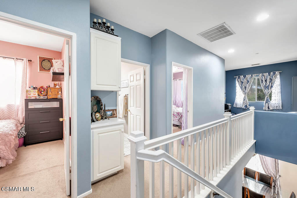 272 Springmist Lane Simi Valley, CA 93065 - Photo 25 of 47 a view of a hallway to a livingroom with wooden floor and windows
