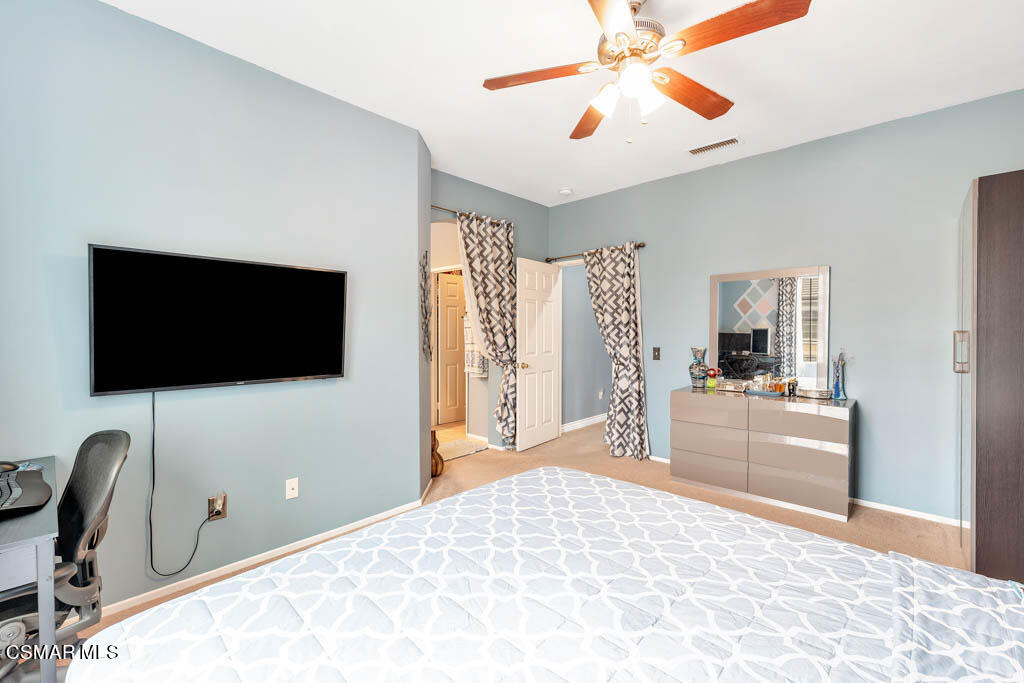 272 Springmist Lane Simi Valley, CA 93065 - Photo 26 of 47 a bedroom with a bed and a flat screen tv
