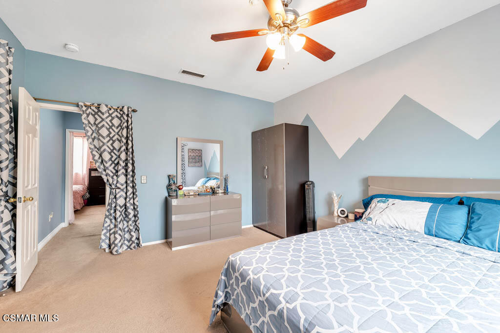 272 Springmist Lane Simi Valley, CA 93065 - Photo 28 of 47 a bedroom with a large bed and a chandelier