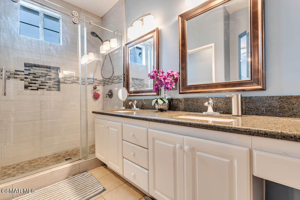 272 Springmist Lane Simi Valley, CA 93065 - Photo 29 of 47 a bathroom with a granite countertop sink and a mirror