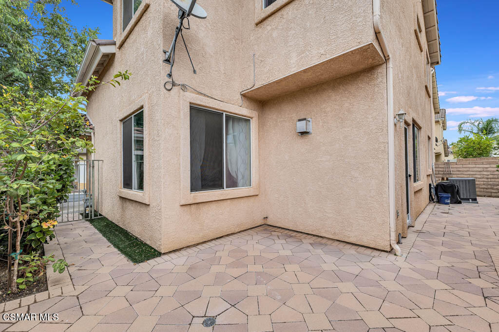 272 Springmist Lane Simi Valley, CA 93065 - Photo 39 of 47 a view of a white house with a yard and sitting area