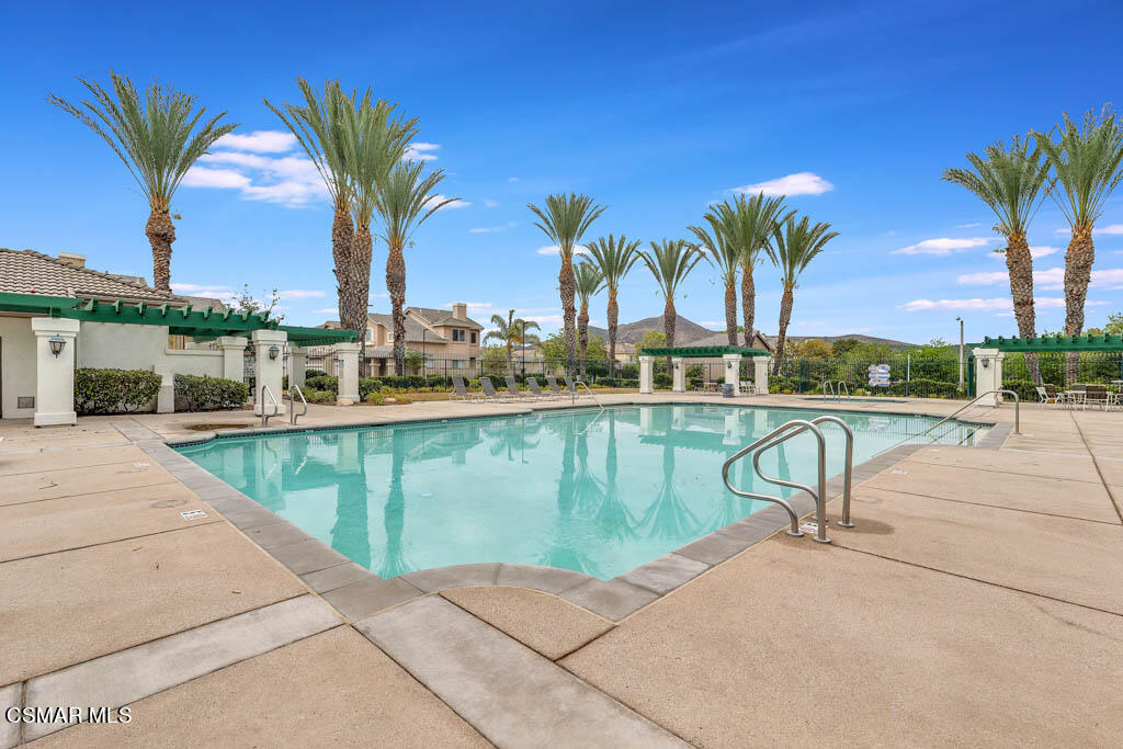 272 Springmist Lane Simi Valley, CA 93065 - Photo 45 of 47 a view of a swimming pool with a table and chairs