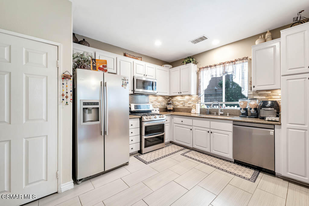 272 Springmist Lane Simi Valley, CA 93065 - Photo 6 of 47 a kitchen with granite countertop cabinets appliances and a counter top space