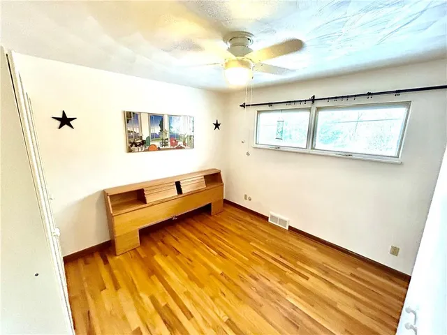 a view of balcony with wooden floor