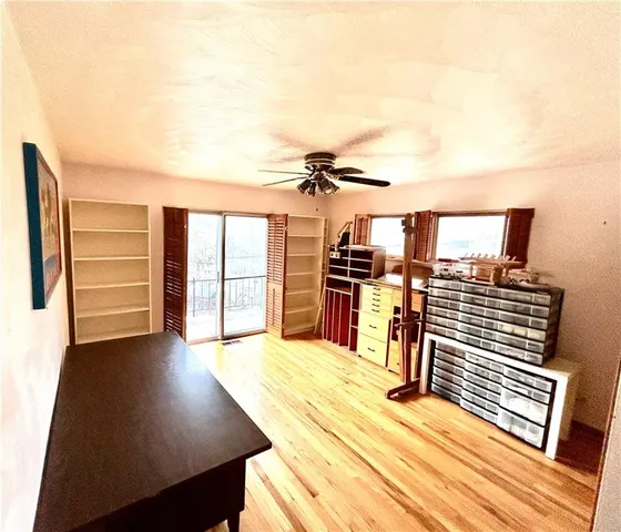 a bedroom with a bed and dresser