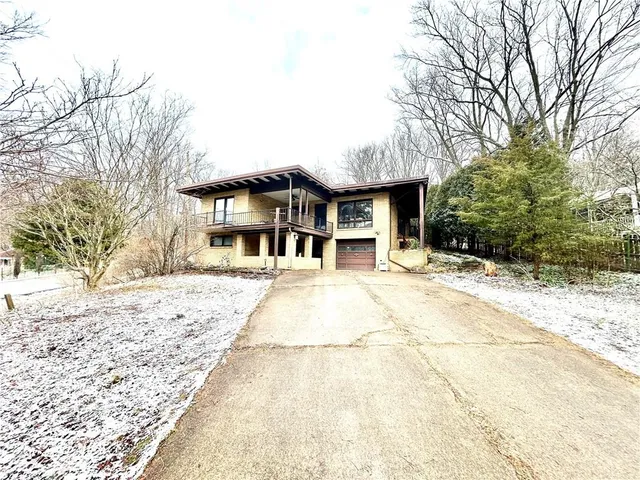 a view of a swimming pool with seating area