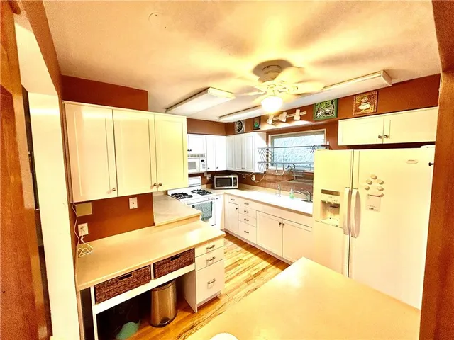a view of a balcony with wooden floor