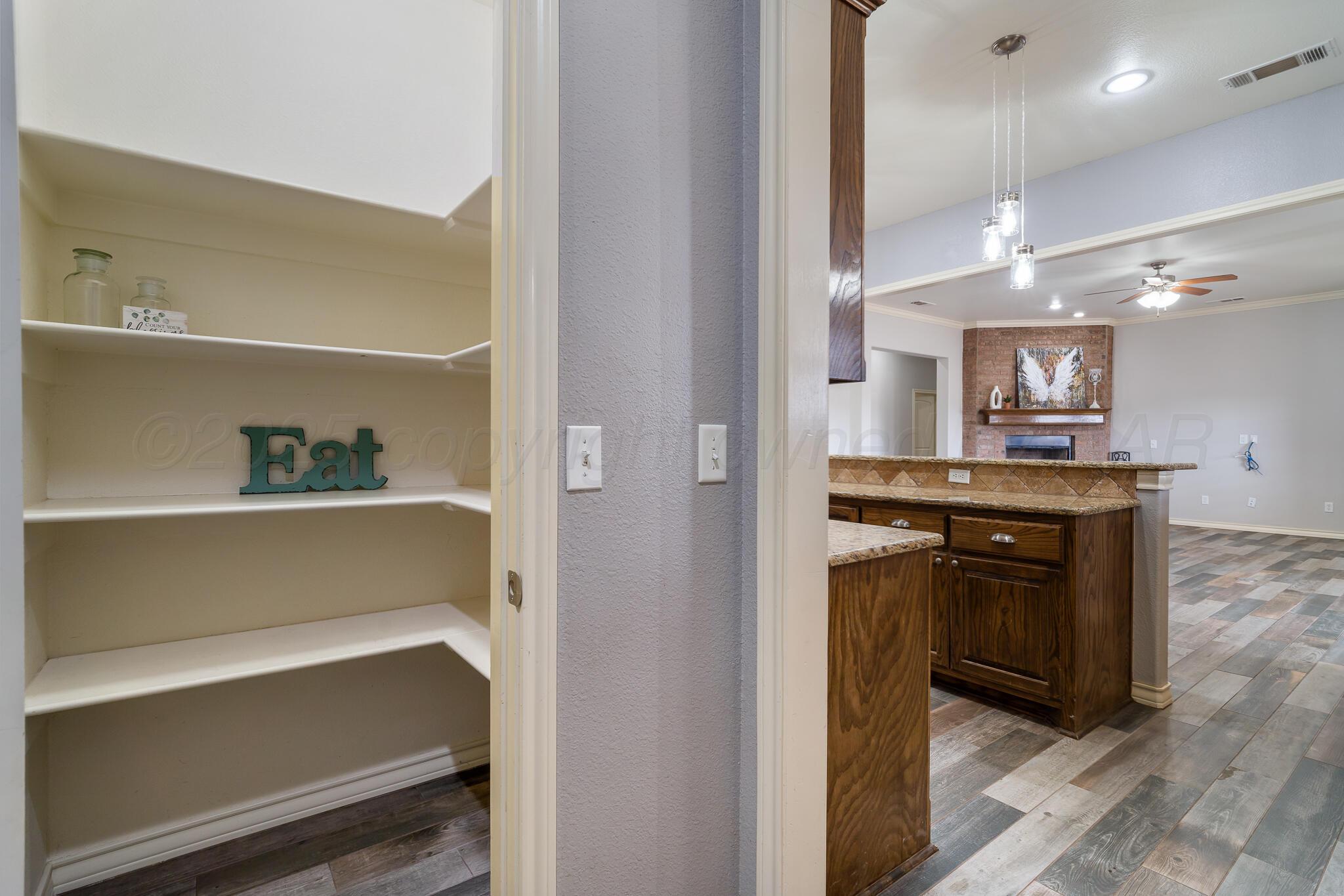 18451 Copper Ridge Bushland, TX 79124 - Photo 15 of 50 a kitchen with a refrigerator and a sink