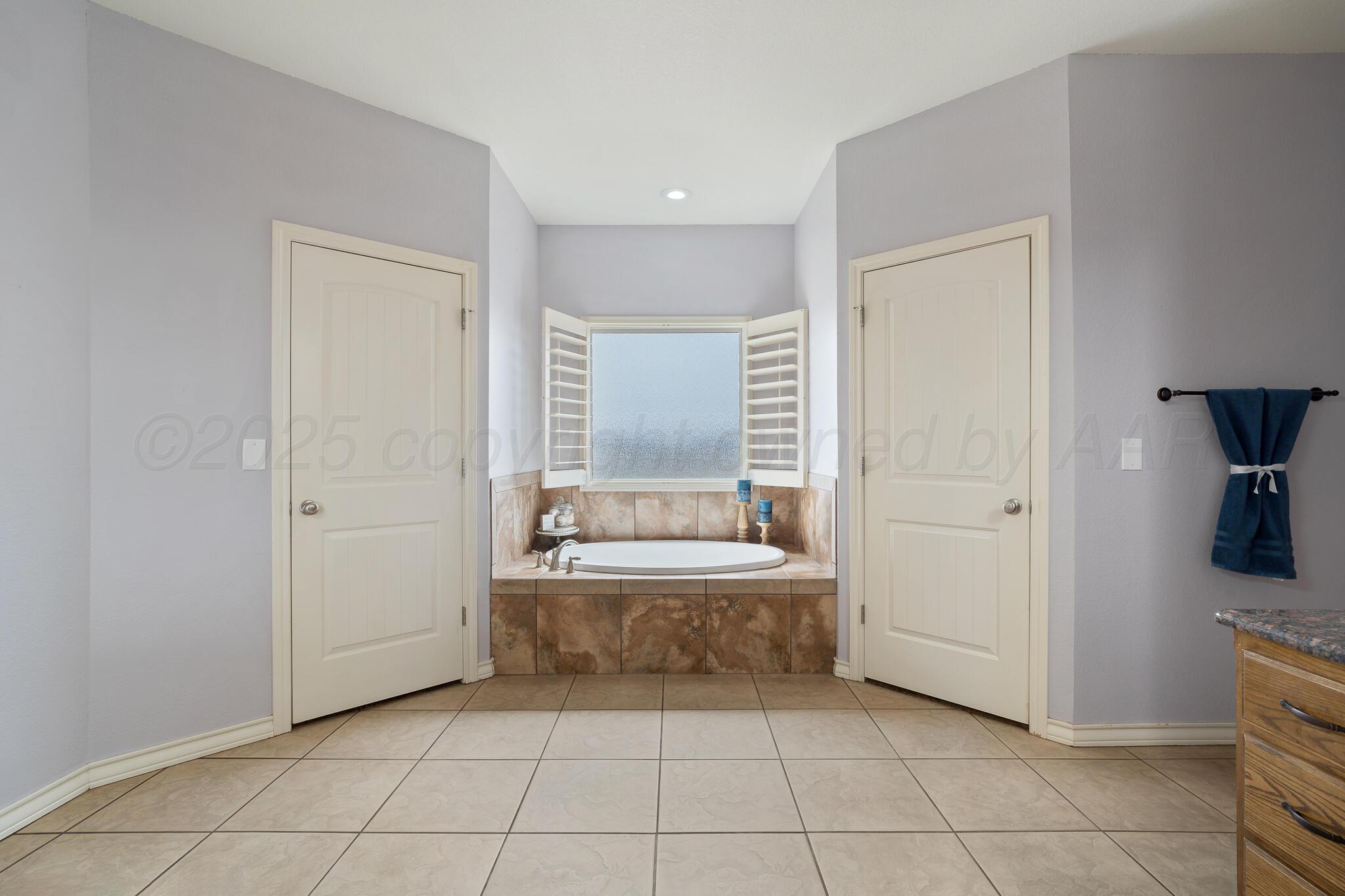 18451 Copper Ridge Bushland, TX 79124 - Photo 20 of 50 a bathroom with a bathtub and a sink