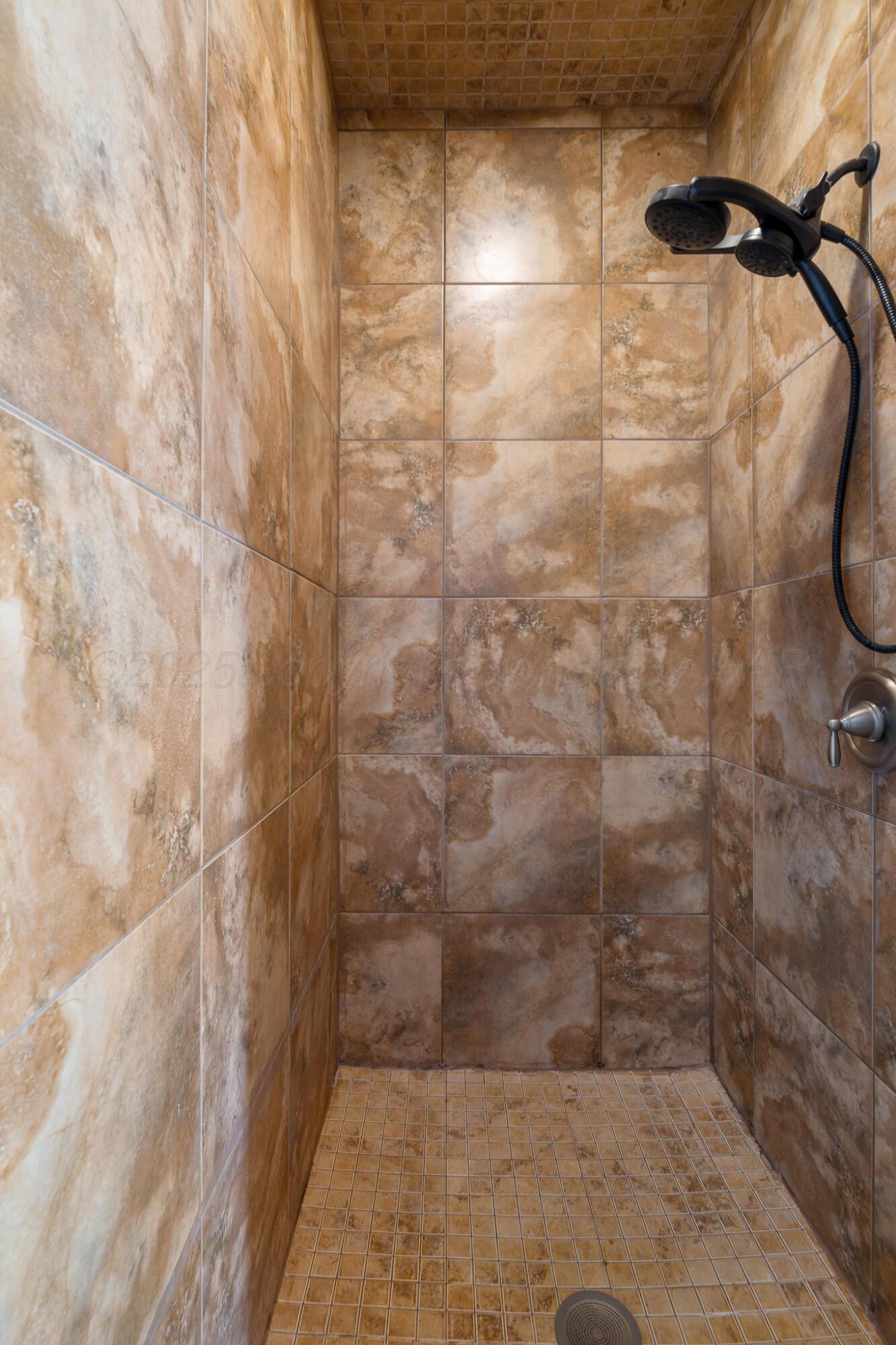 18451 Copper Ridge Bushland, TX 79124 - Photo 22 of 50 a bathroom with a shower