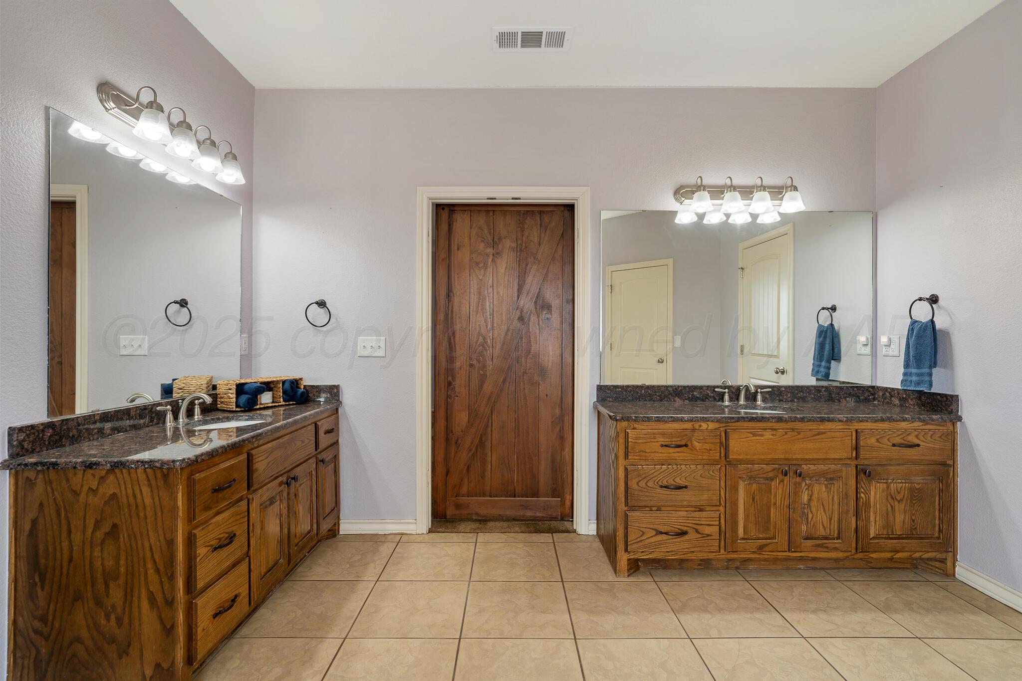 18451 Copper Ridge Bushland, TX 79124 - Photo 23 of 50 a kitchen with stainless steel appliances granite countertop a stove and a sink