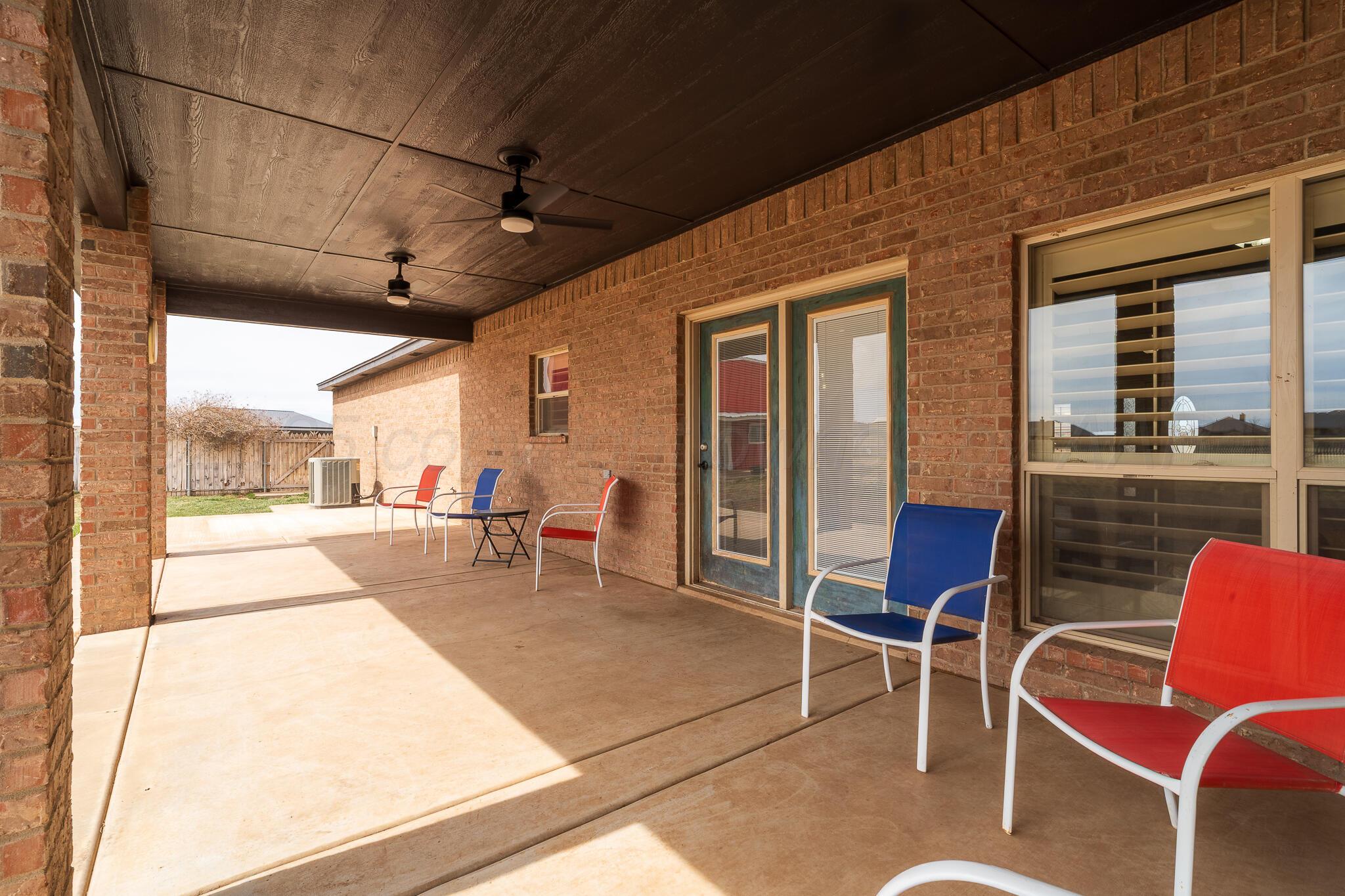 18451 Copper Ridge Bushland, TX 79124 - Photo 34 of 50 a view of a patio with table and chairs and wooden floor