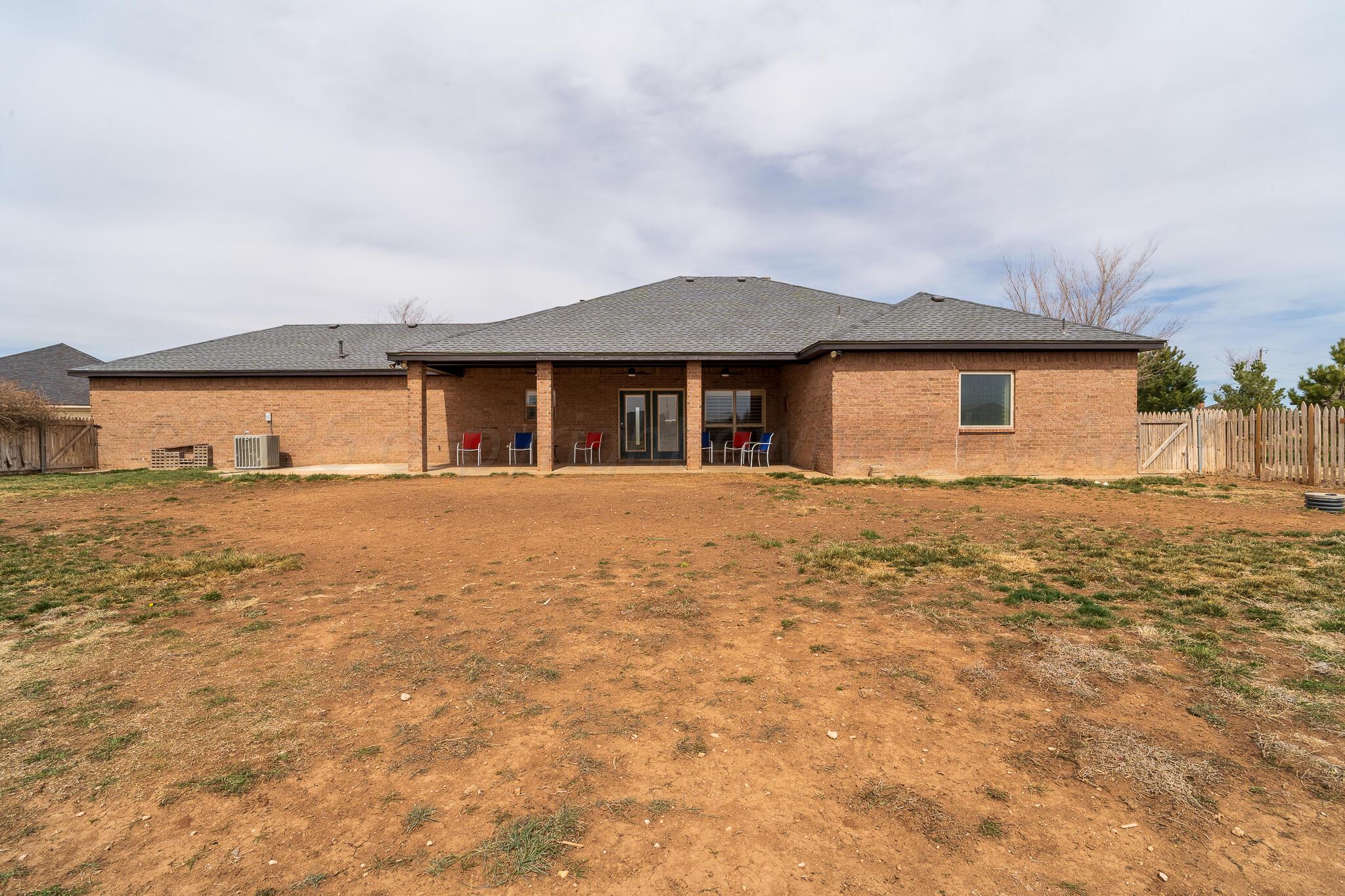 18451 Copper Ridge Bushland, TX 79124 - Photo 37 of 50 a front view of a house with a yard