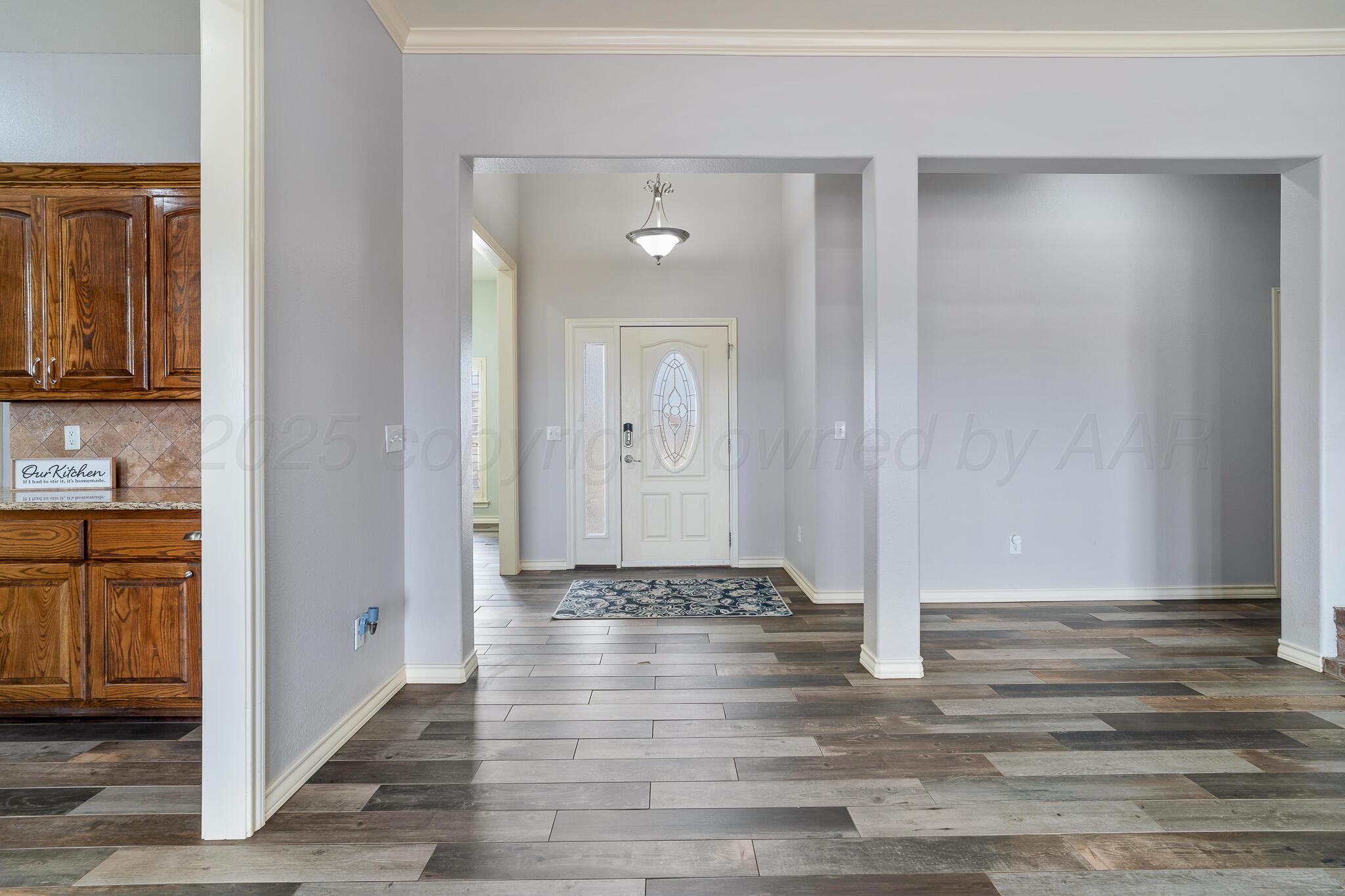 18451 Copper Ridge Bushland, TX 79124 - Photo 6 of 50 a view of a hallway with wooden floor