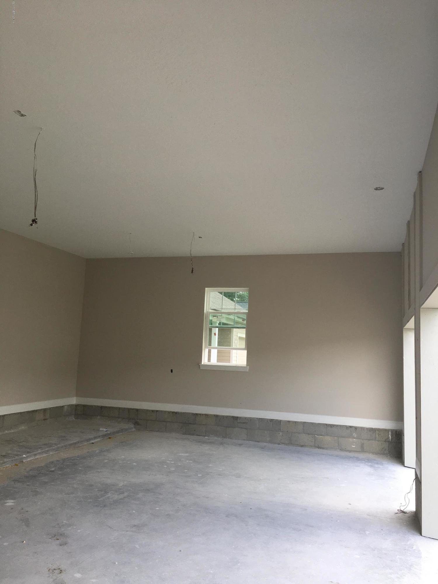 332 Rambling Water Run St. Johns, FL 32259 - Photo 26 of 36 Spacious Garage with 11' Ceilings