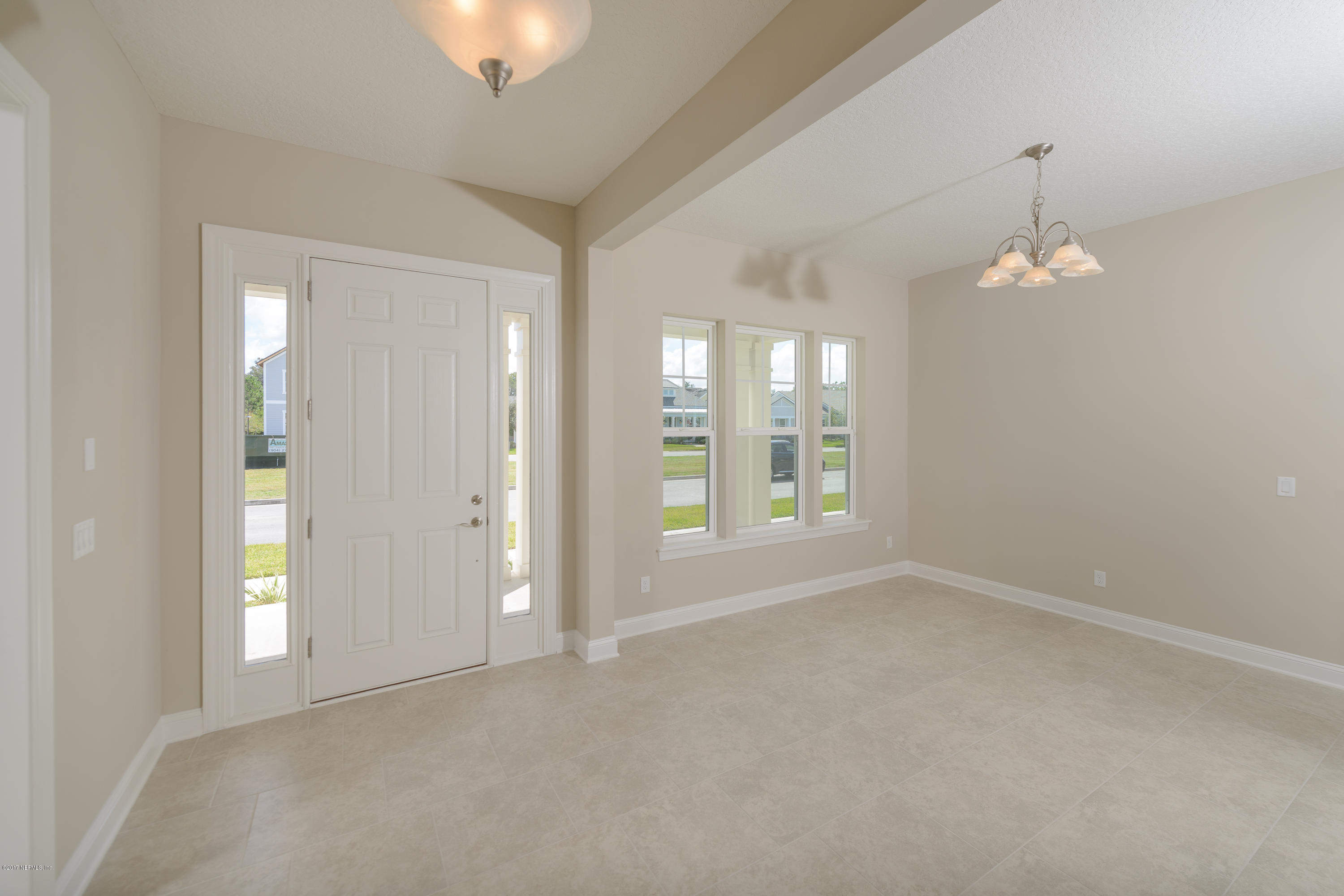 332 Rambling Water Run St. Johns, FL 32259 - Photo 10 of 36 foyer to formal dining room