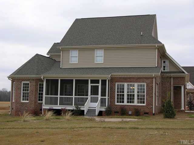 3313 Cotton Road Raleigh, NC 27601 - Photo 8 of 10 a house that has a large window in front of it