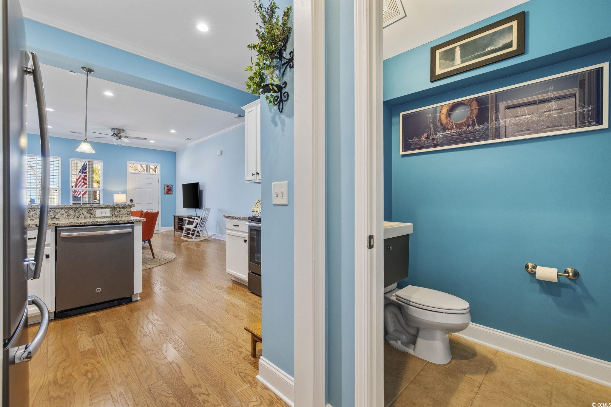 718 Shine Avenue, Unit 718 Myrtle Beach, SC 29577 - Photo 16 of 36 Half bath with a ceiling fan, recessed lighting, vanity, and crown molding
