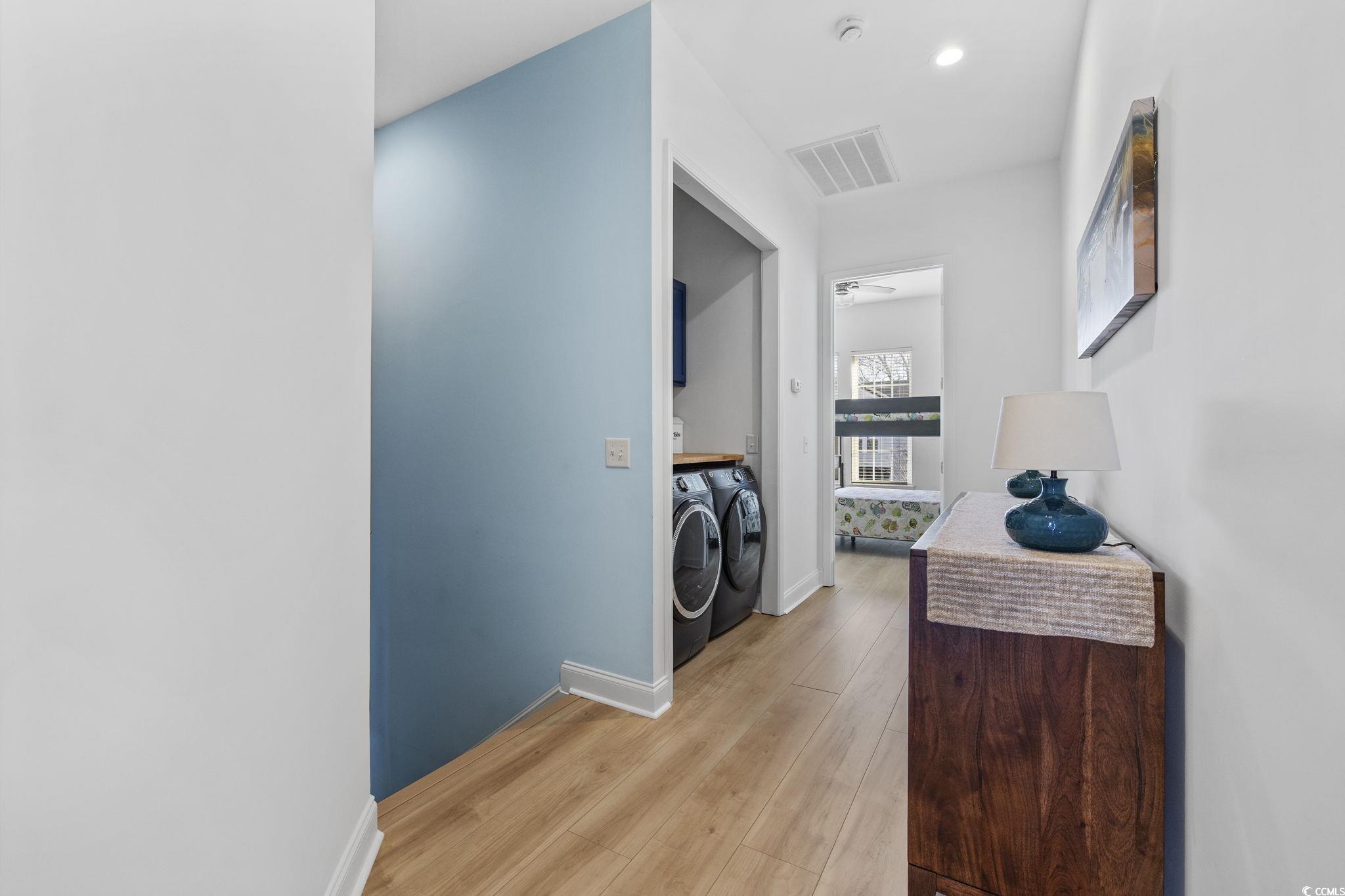 718 Shine Avenue, Unit 718 Myrtle Beach, SC 29577 - Photo 18 of 36 Corridor with separate washer and dryer, light wood-style flooring, and recessed lighting