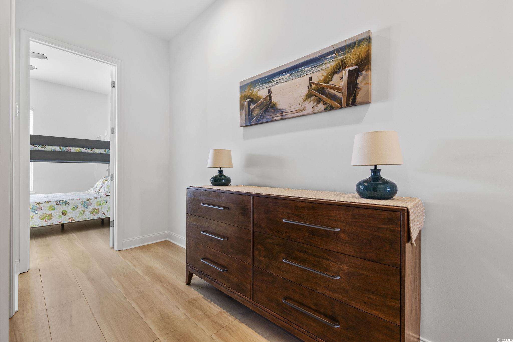 718 Shine Avenue, Unit 718 Myrtle Beach, SC 29577 - Photo 19 of 36 Hallway with light wood-style floors and baseboards