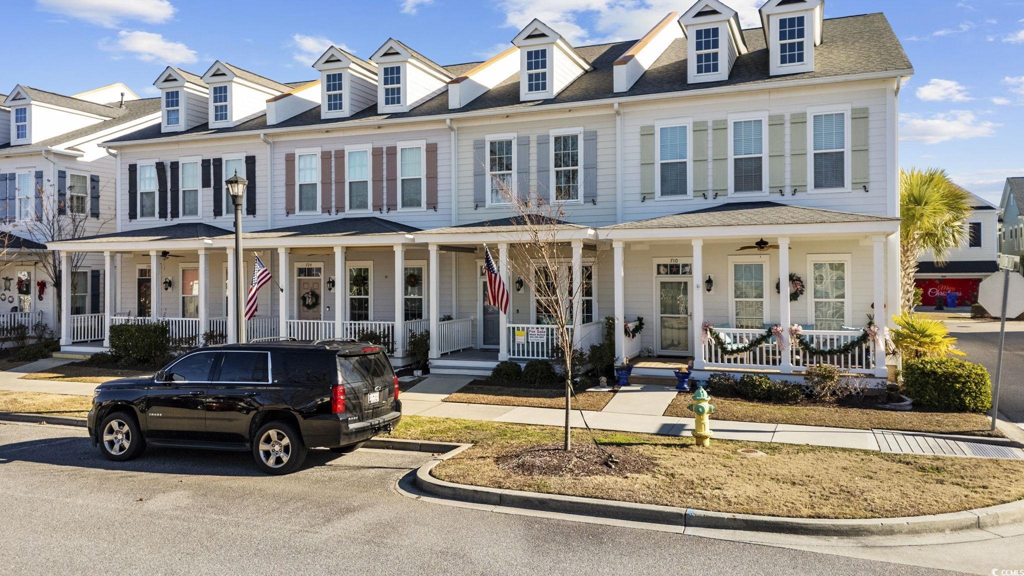 718 Shine Avenue, Unit 718 Myrtle Beach, SC 29577 - Photo 2 of 36 View of front of home featuring a porch and a shingled roof