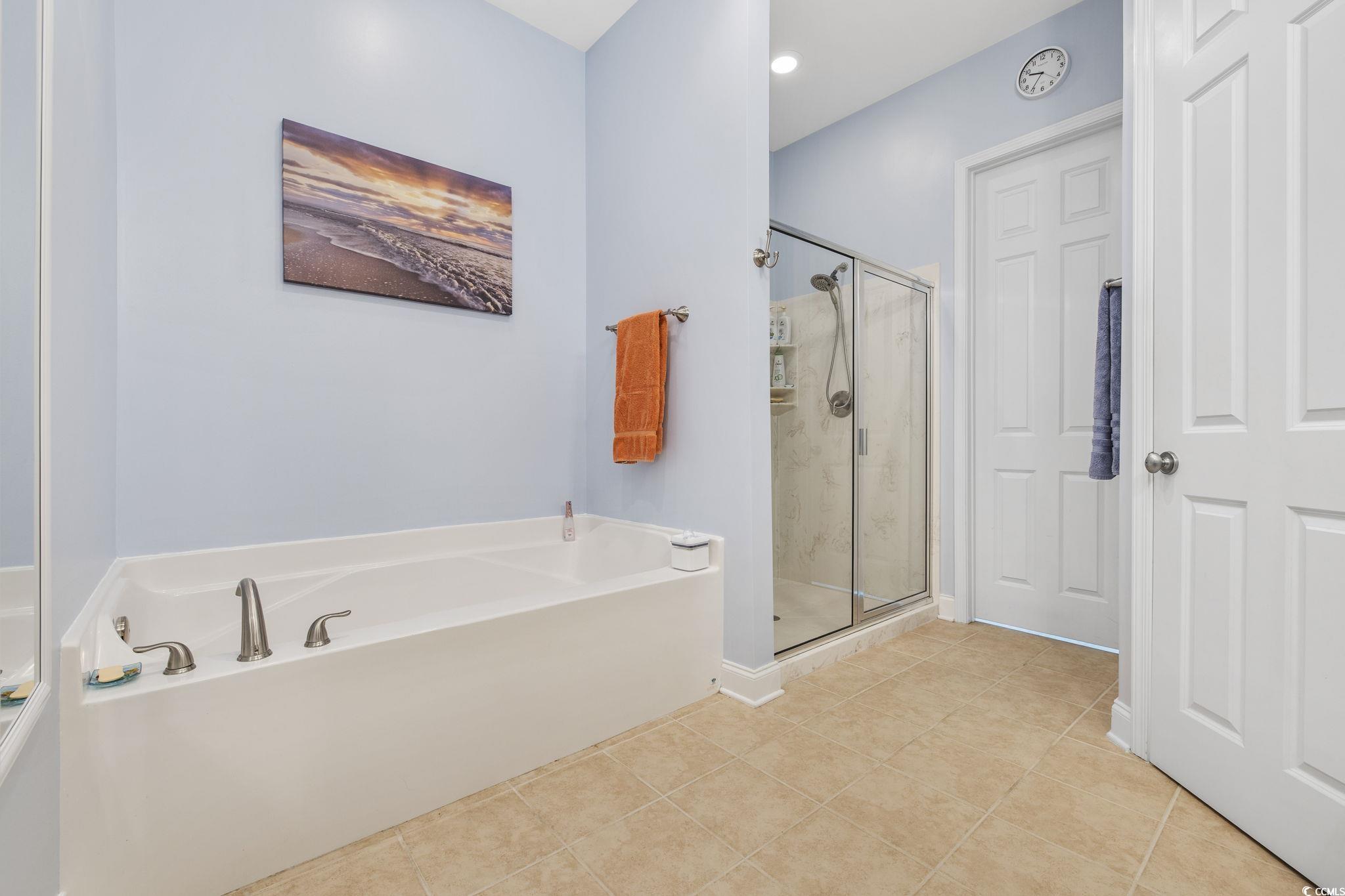 718 Shine Avenue, Unit 718 Myrtle Beach, SC 29577 - Photo 25 of 36 Full bath featuring a garden tub, a marble finish shower, light tile patterned floors, and recessed lighting