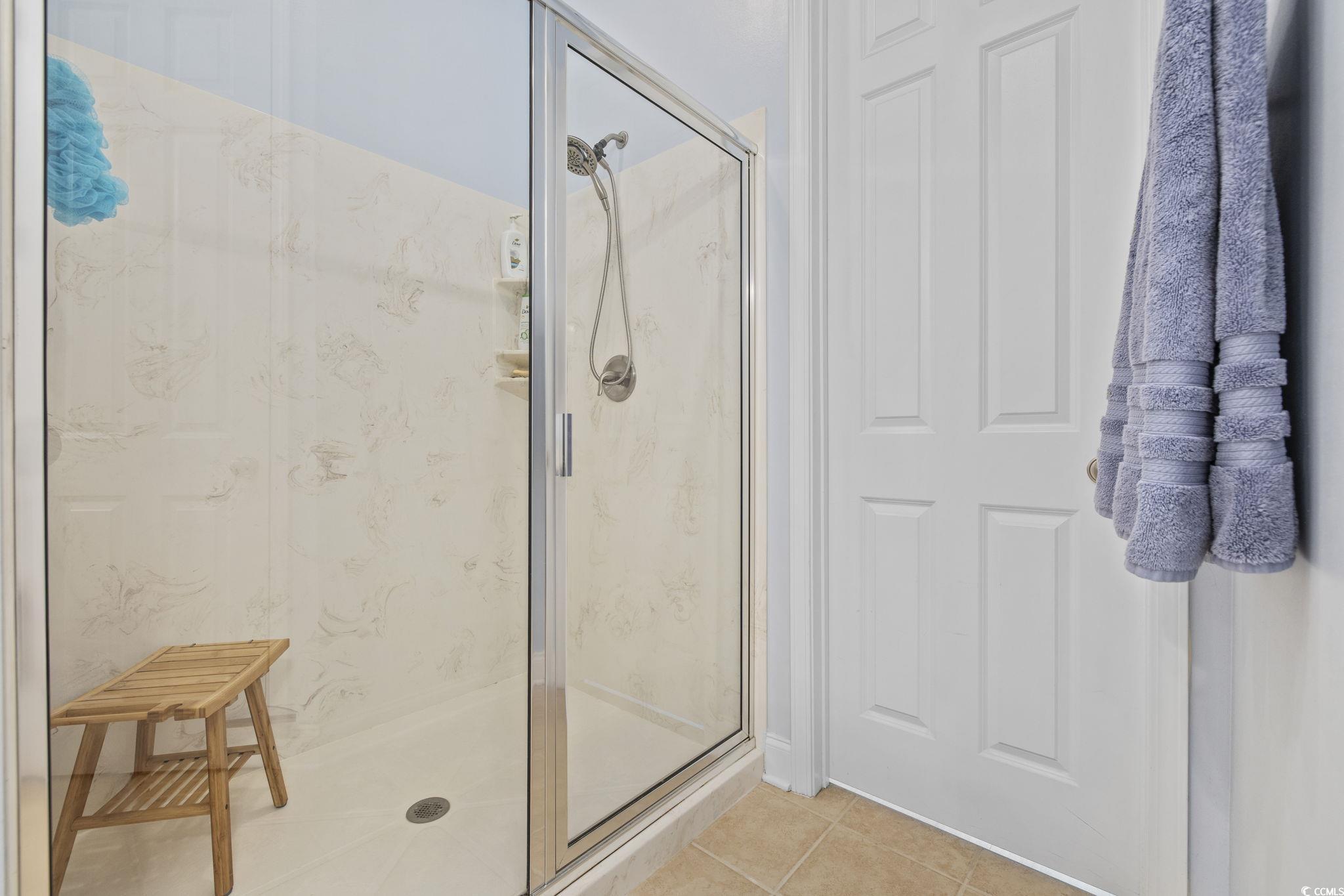 718 Shine Avenue, Unit 718 Myrtle Beach, SC 29577 - Photo 26 of 36 Bathroom featuring tile patterned floors and a marble finish shower