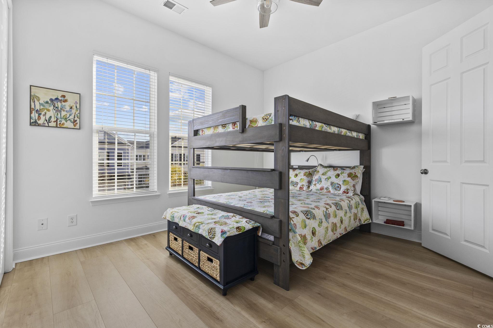 718 Shine Avenue, Unit 718 Myrtle Beach, SC 29577 - Photo 28 of 36 Bedroom with a ceiling fan and light wood-style flooring