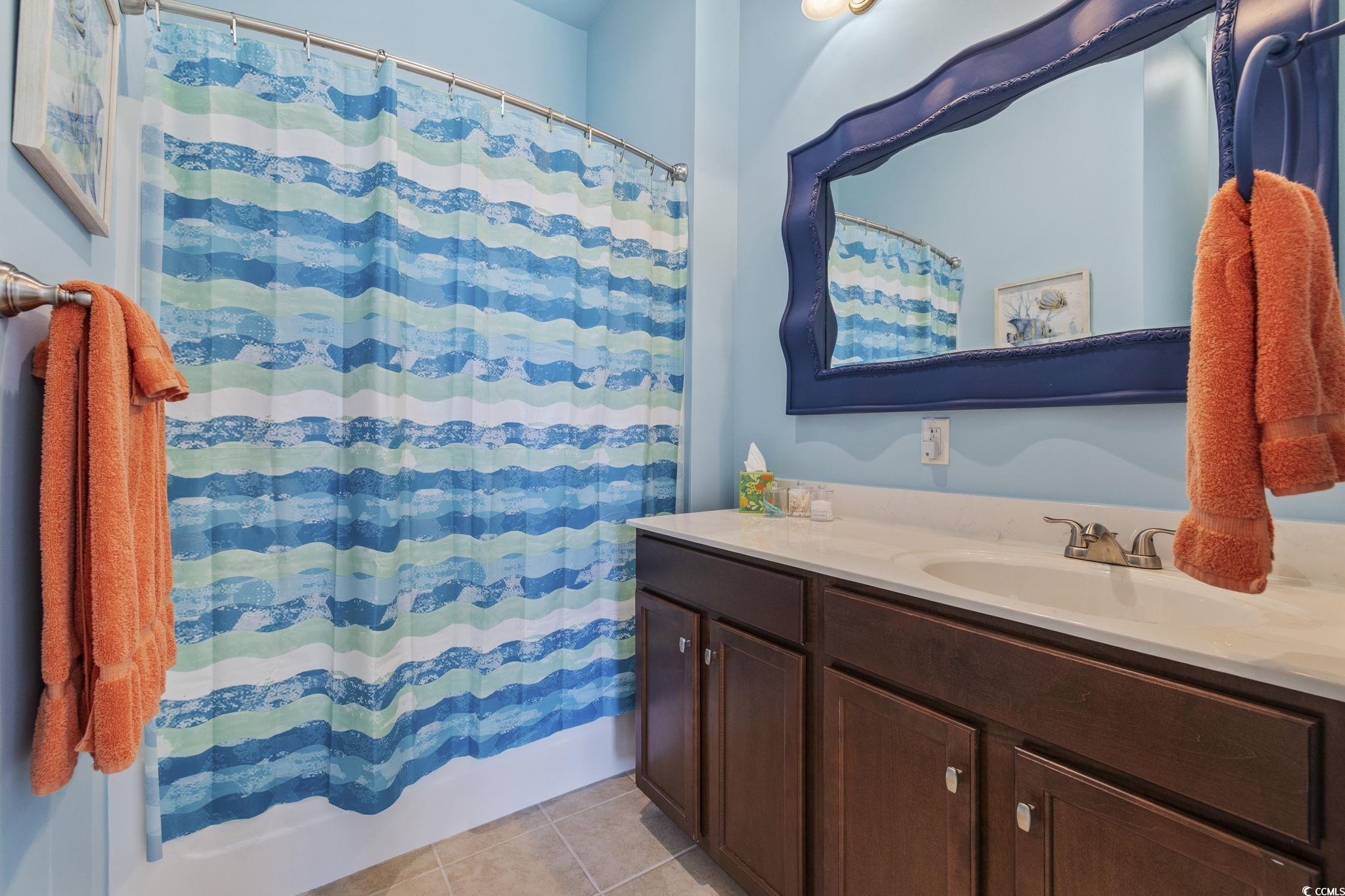 718 Shine Avenue, Unit 718 Myrtle Beach, SC 29577 - Photo 30 of 36 Bathroom featuring vanity and light tile patterned flooring