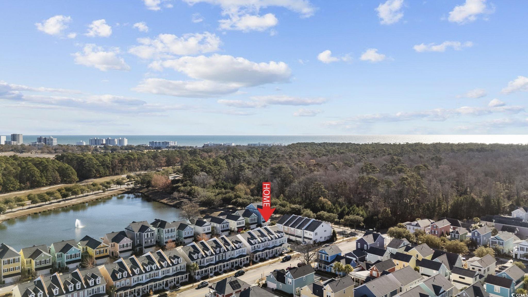 718 Shine Avenue, Unit 718 Myrtle Beach, SC 29577 - Photo 35 of 36 Aerial perspective of suburban area featuring a nearby body of water and a forest