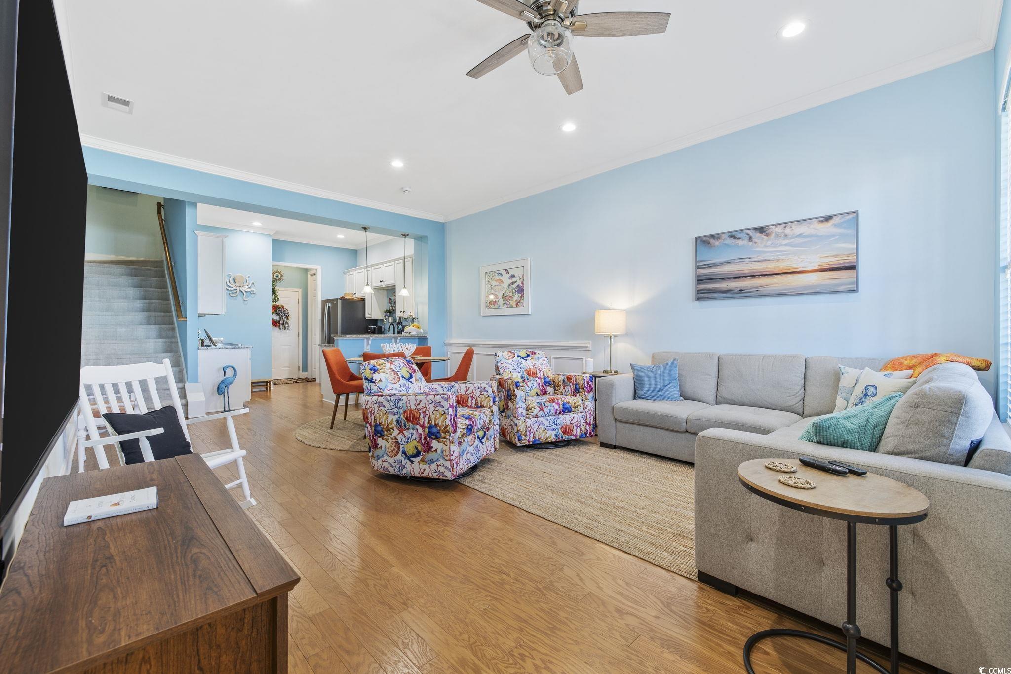 718 Shine Avenue, Unit 718 Myrtle Beach, SC 29577 - Photo 5 of 36 Living room featuring ornamental molding, stairway, light wood-style flooring, recessed lighting, and a ceiling fan