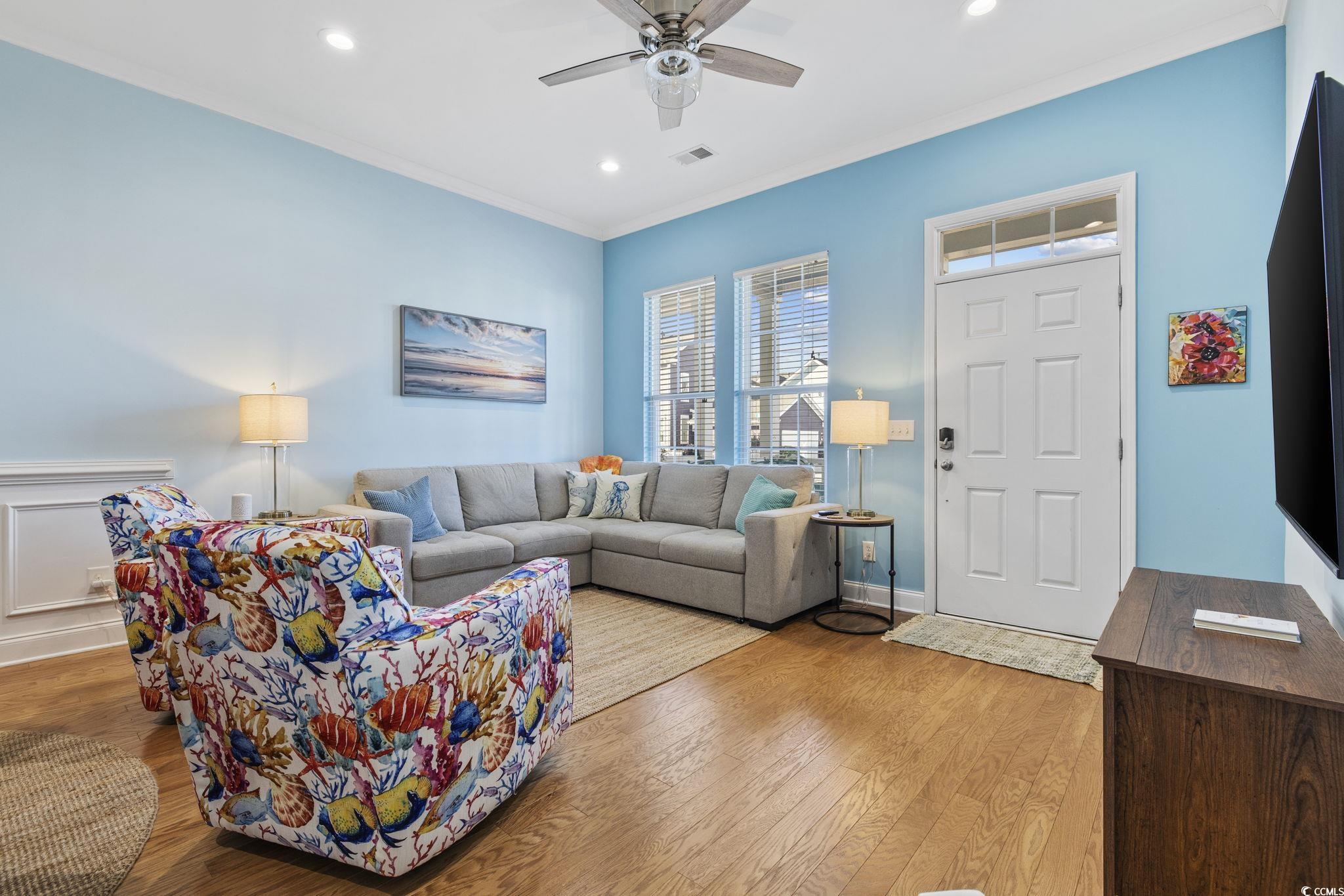 718 Shine Avenue, Unit 718 Myrtle Beach, SC 29577 - Photo 6 of 36 Living area featuring ornamental molding, hardwood / wood-style floors, recessed lighting, and ceiling fan