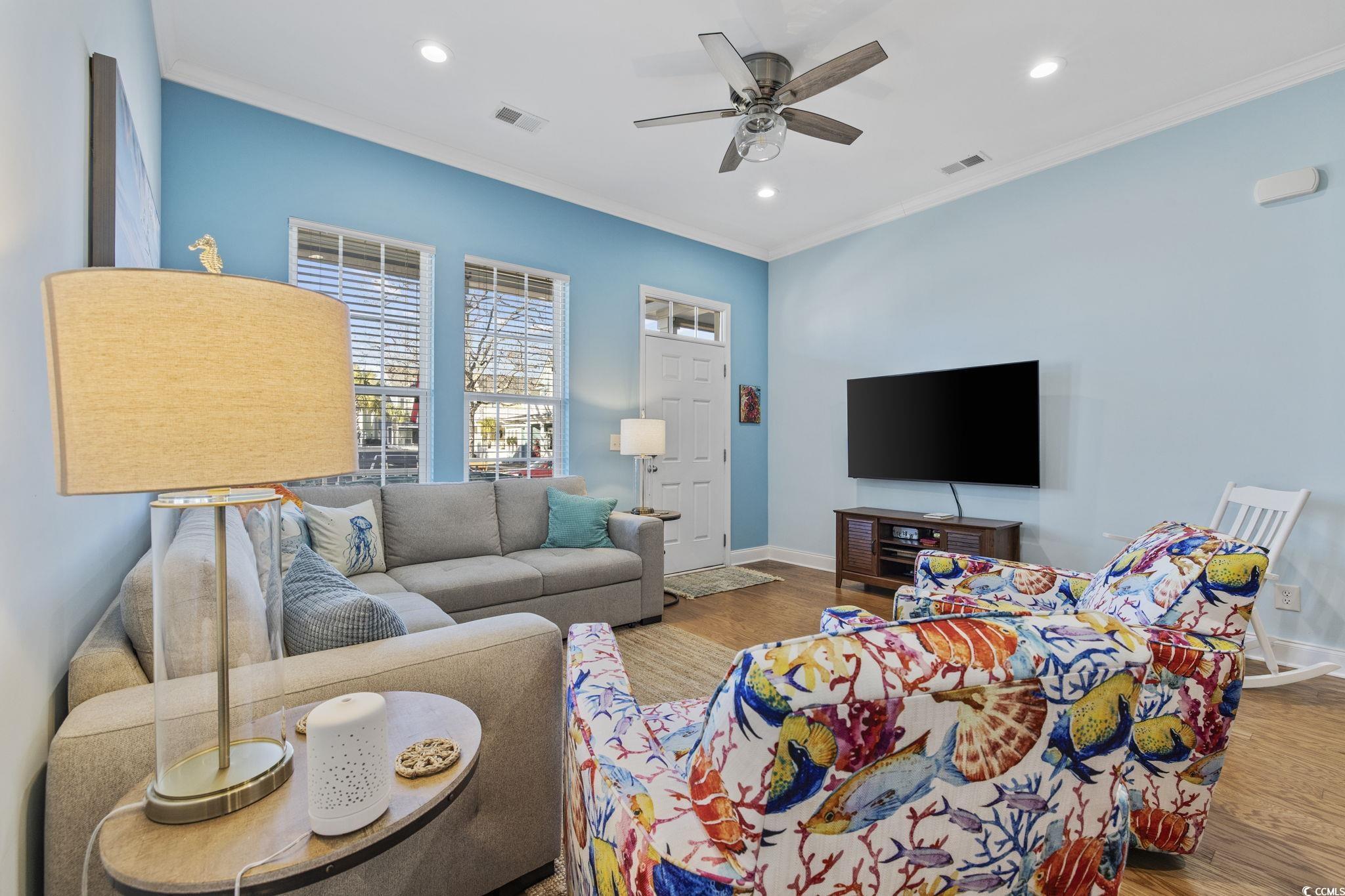 718 Shine Avenue, Unit 718 Myrtle Beach, SC 29577 - Photo 8 of 36 Living room featuring wood finished floors, crown molding, recessed lighting, and a ceiling fan