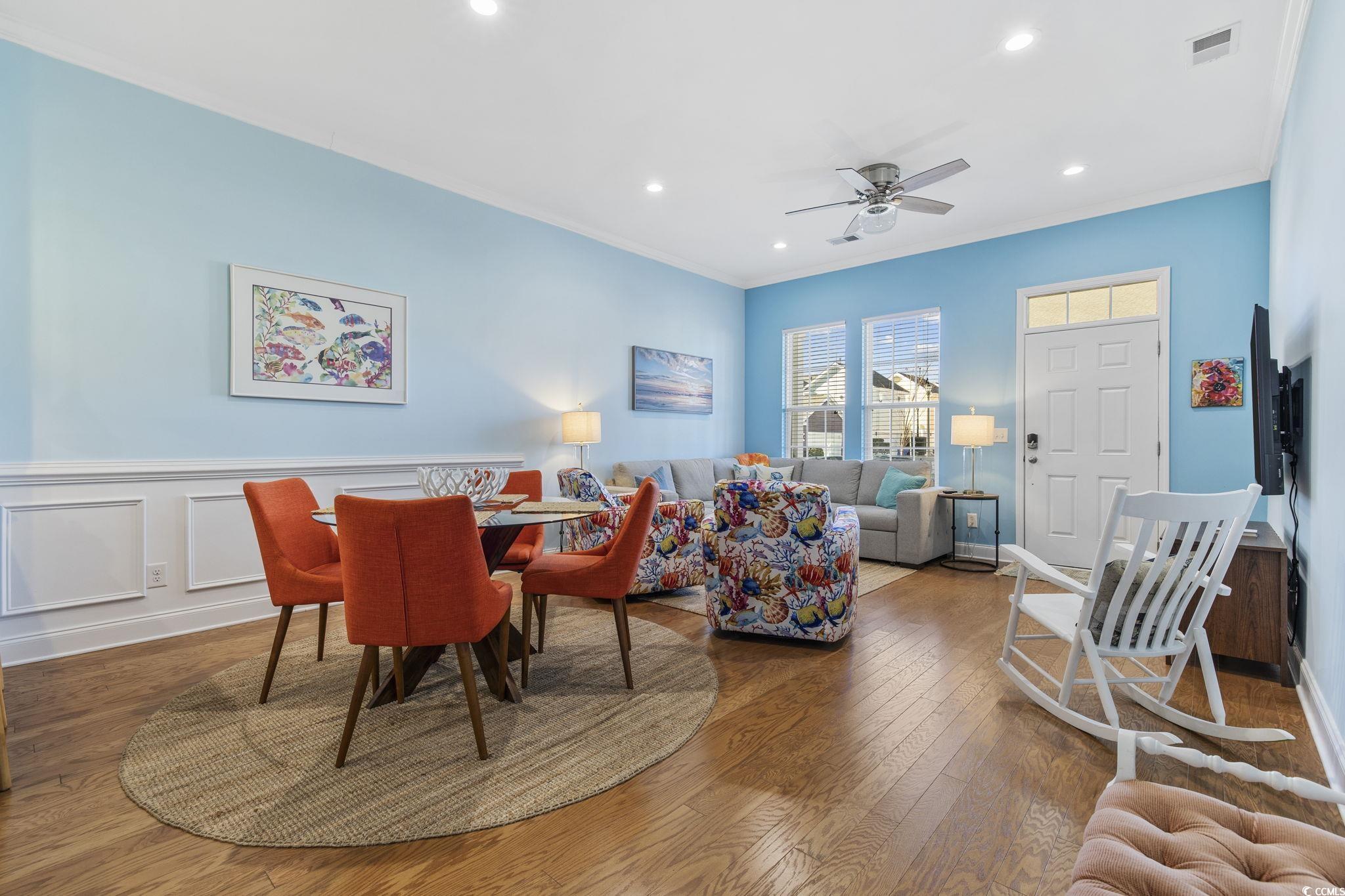 718 Shine Avenue, Unit 718 Myrtle Beach, SC 29577 - Photo 9 of 36 Dining room featuring ornamental molding, hardwood / wood-style flooring, recessed lighting, a ceiling fan, and a decorative wall