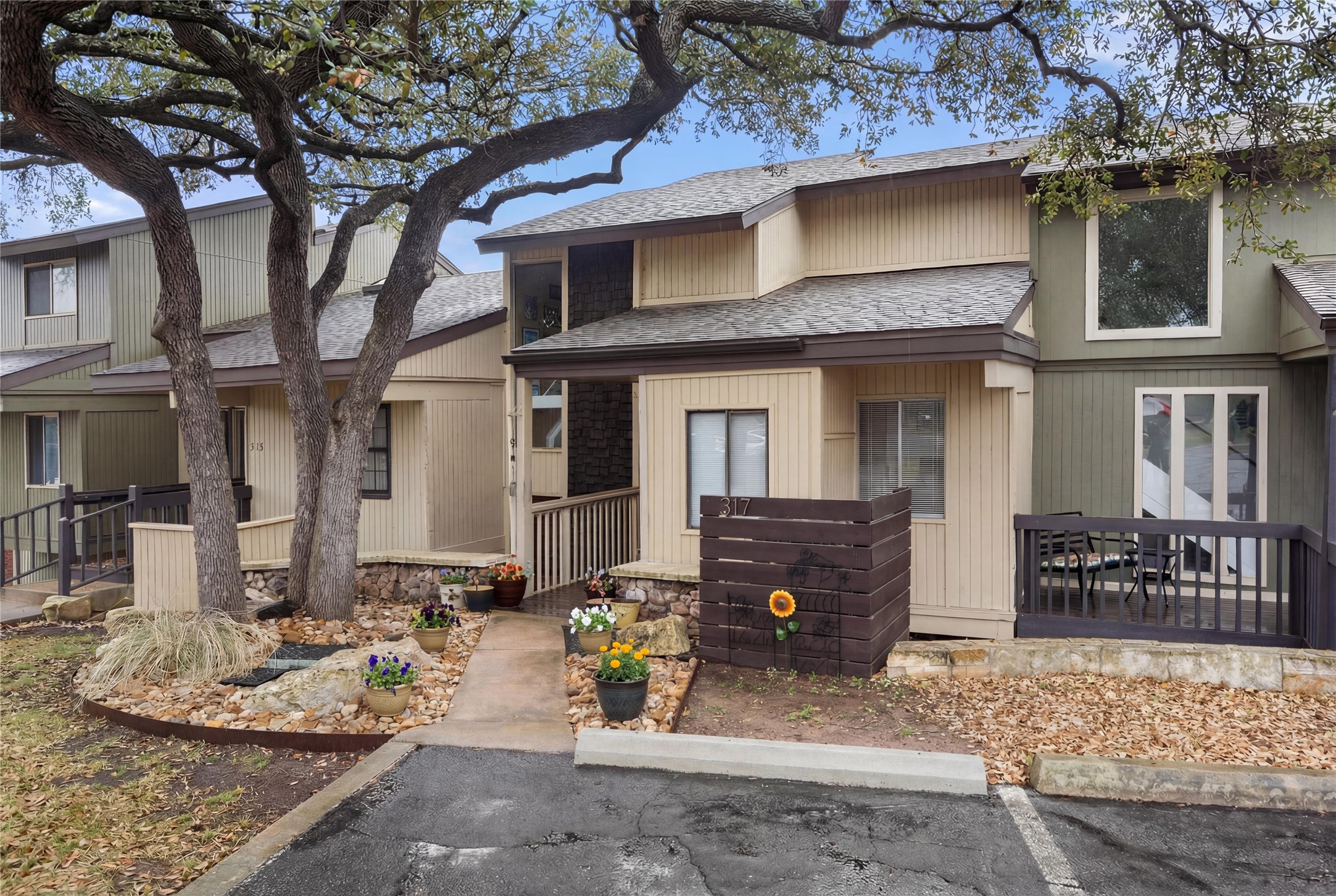 317 Venture Boulevard South Point Venture, TX 78645 - Photo 1 of 17 a front view of a house with patio