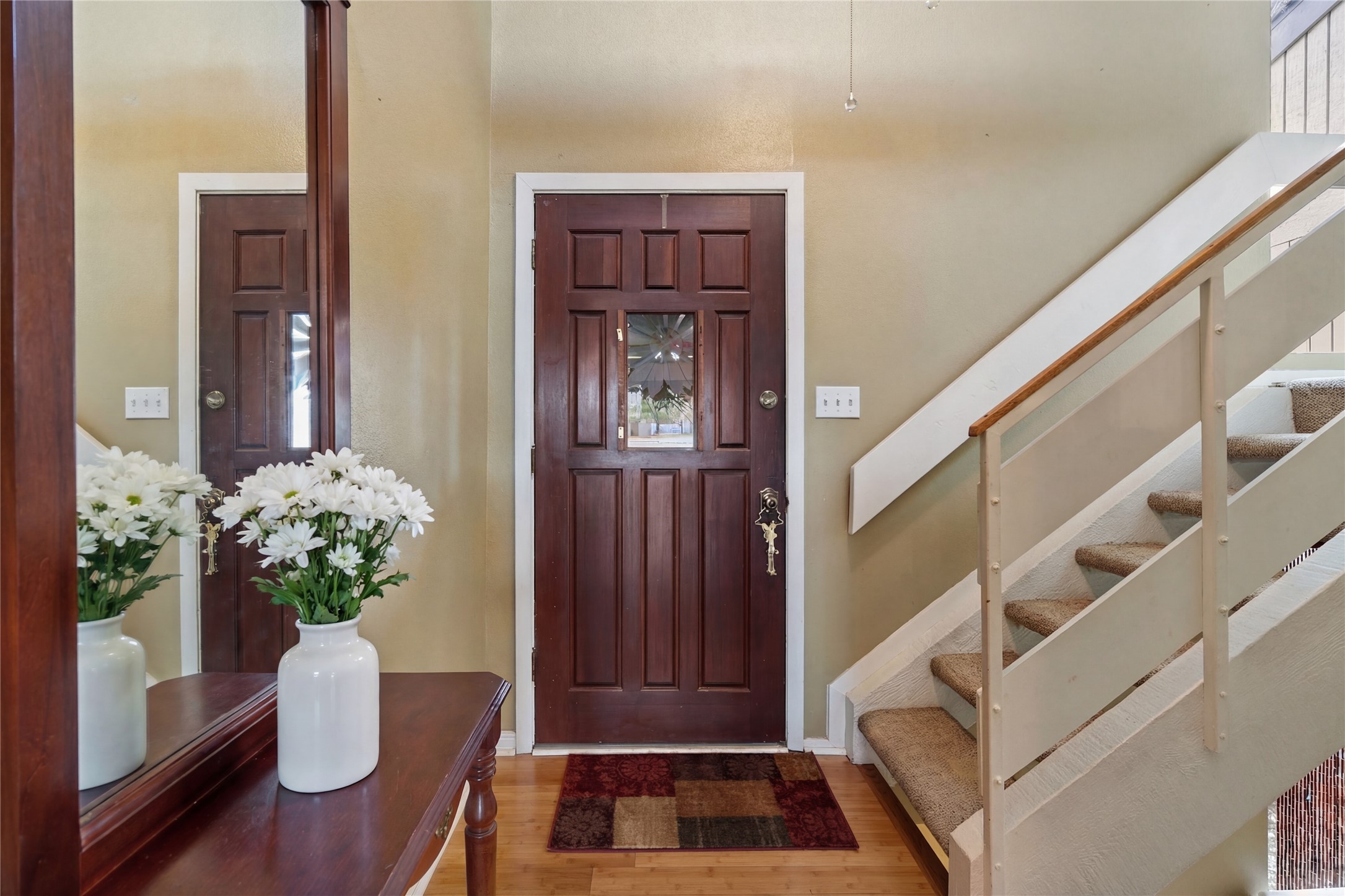 317 Venture Boulevard South Point Venture, TX 78645 - Photo 16 of 17 a view of staircase with wooden floor and a potted plant