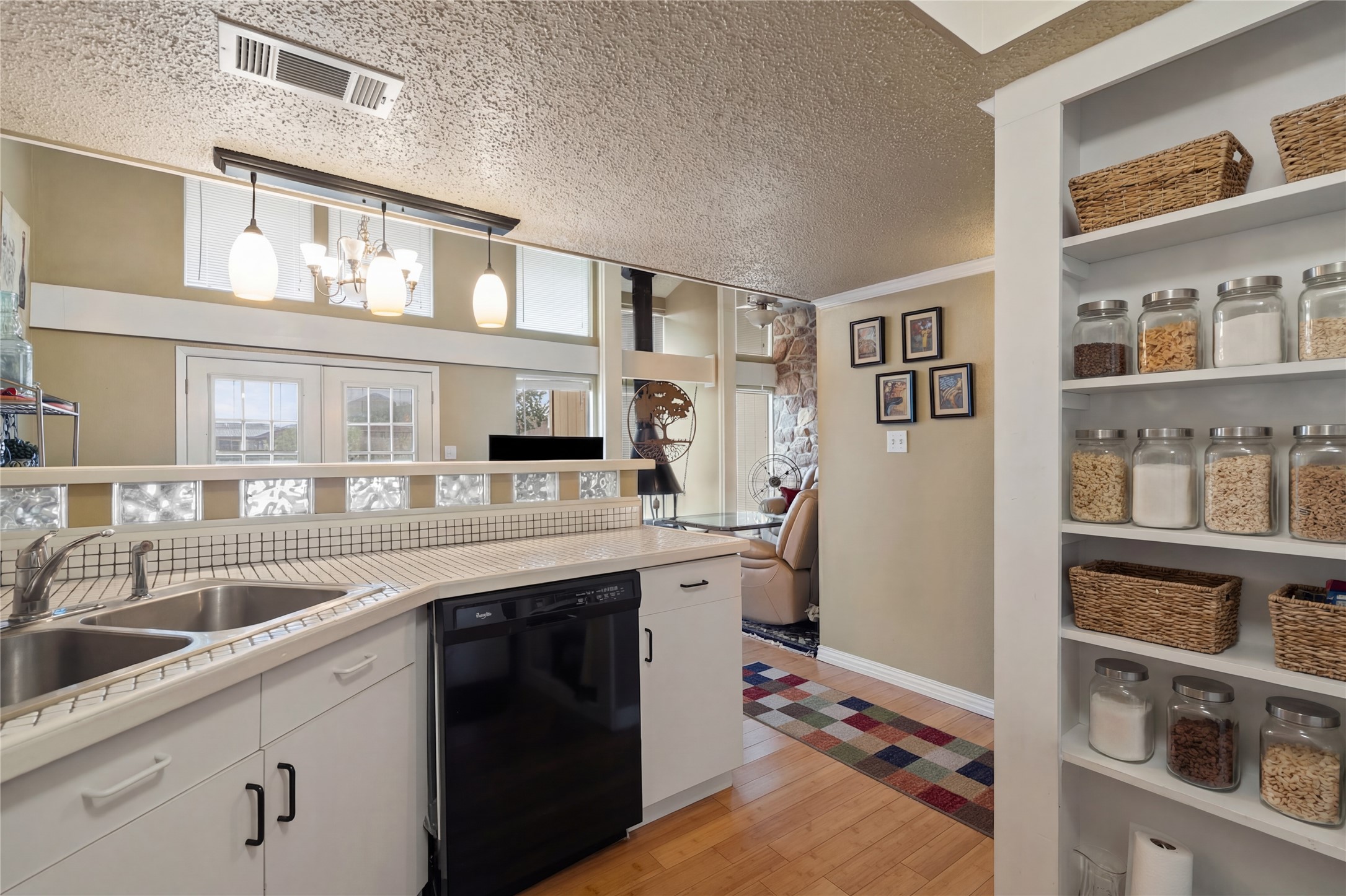 317 Venture Boulevard South Point Venture, TX 78645 - Photo 5 of 17 a kitchen with stainless steel appliances granite countertop a sink and cabinets