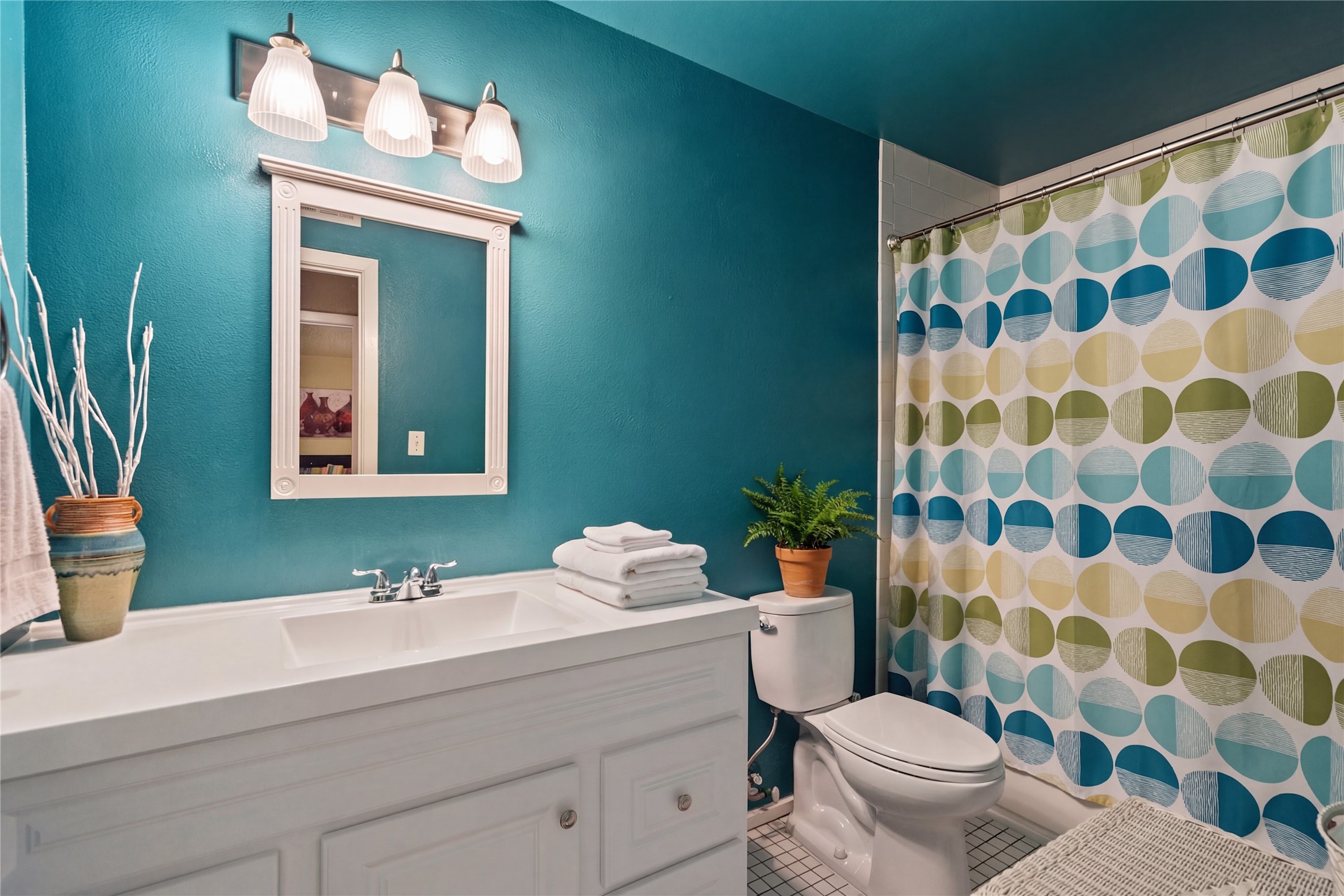 317 Venture Boulevard South Point Venture, TX 78645 - Photo 7 of 17 a bathroom with a sink and a mirror