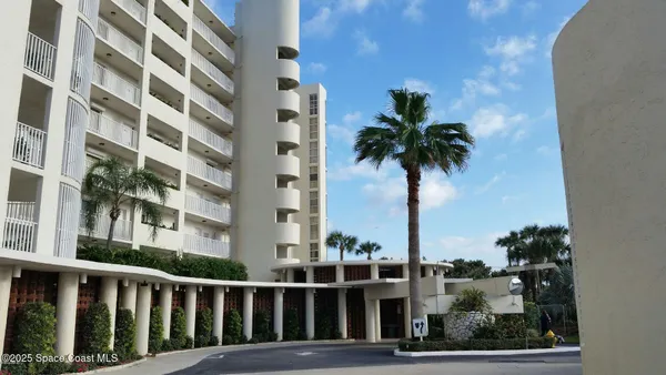 a view of a tall building from a balcony