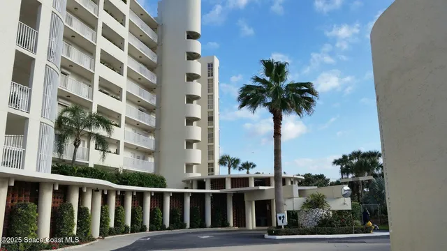 a view of a tall building from a balcony