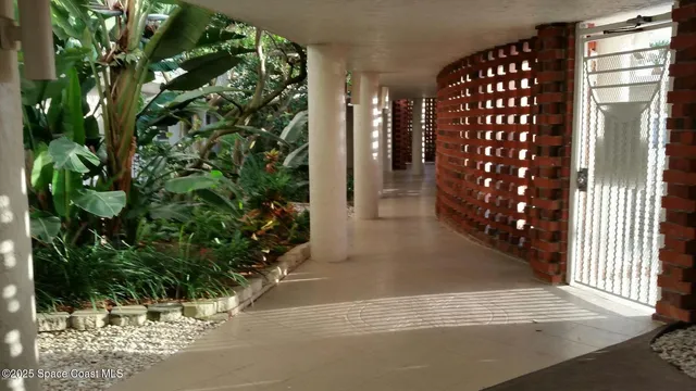 a view of entryway with flower plants