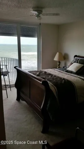 a bedroom with a bed and a desk