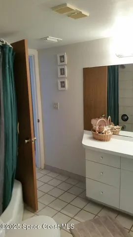a view of a roof deck with chair and garden view