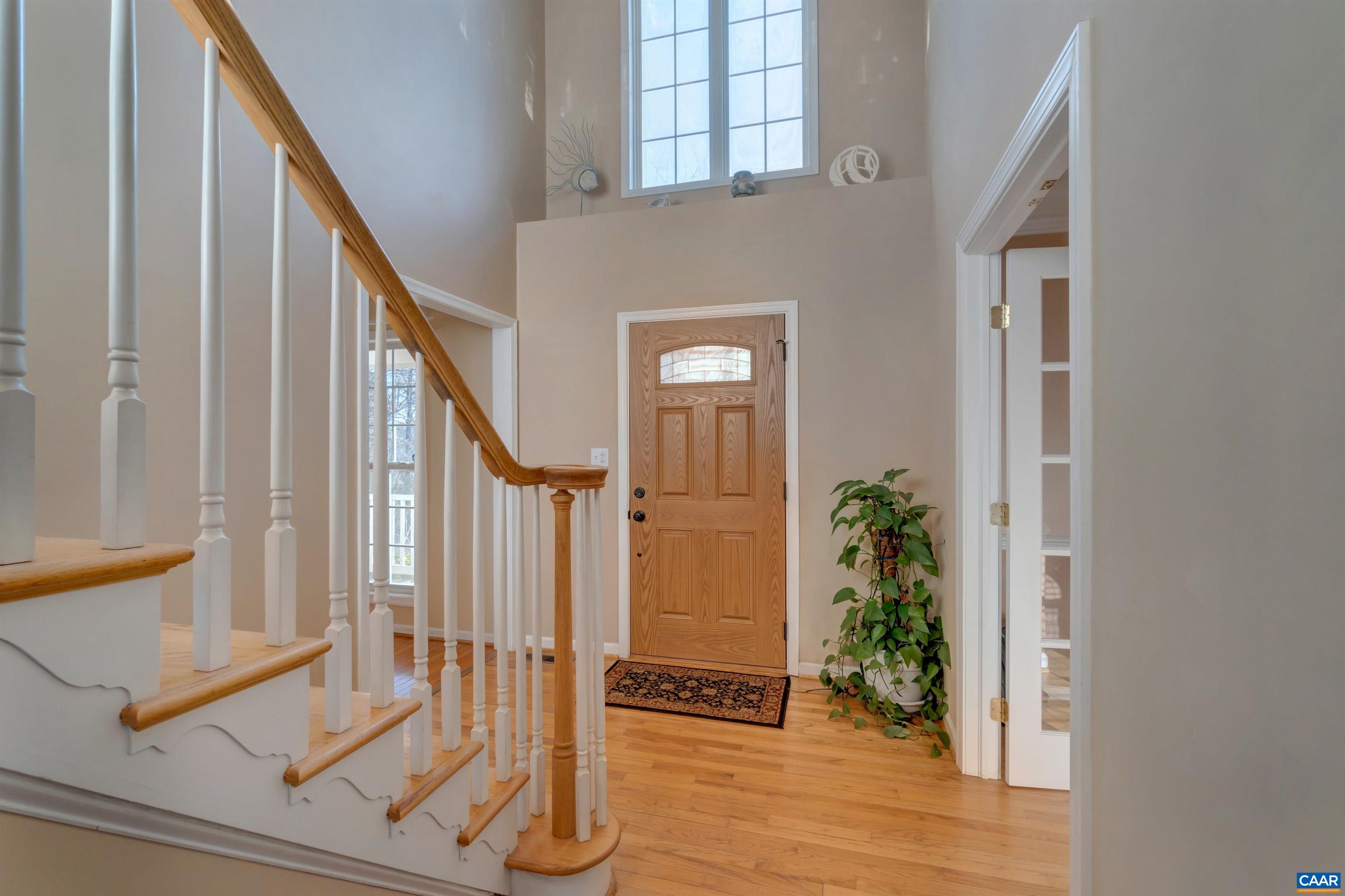 222 Starcrest Road Charlottesville, VA 22902 - Photo 9 of 46 a view of an entryway with wooden floor and door